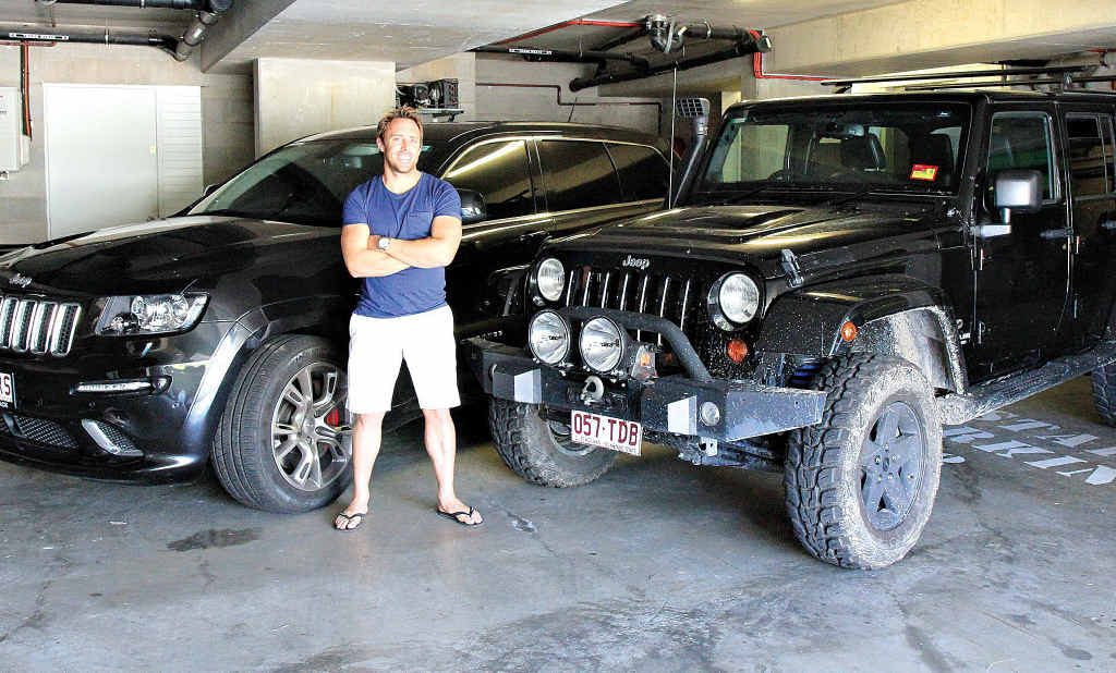 Big wave surfer Mark Visser with his Jeep duo. Big wave surfer Mark Visser with his Jeep duo.
